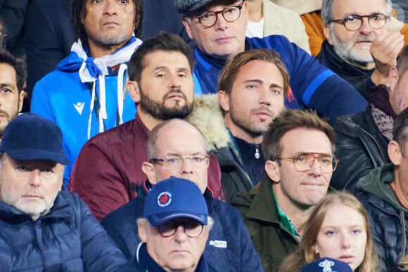 Christophe Beaugrand et son mari Ghislain Gerin - People des les tribunes de la coupe du Monde de Rugby France 2023 - Match de quart de finale "France-Afrique du Sud (28-29)" au Stade de France à Saint-Denis 15 octobre 2023. © Moreau-Jacovides/Bestimage 