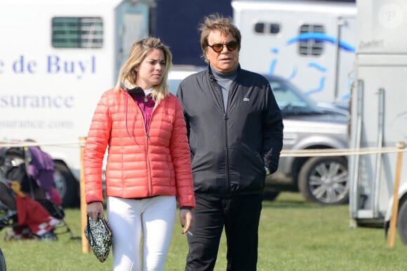 Sophie Tapie et Bernard Tapie assistant au saut d'obstacles international de Chantilly à Chantilly, au nord-est de Paris, en France, le 21 avril 2013. Photo par Nicolas Briquet/ABACAPRESS.COM