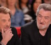 Le Taulier a finalement succombé à un cancer...
Johnny Hallyday et Eddy Mitchell lors de l'enregistrement de Vivement Dimanche à Paris, France, le 13 mars 2014.