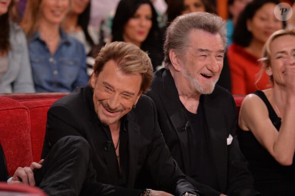 Johnny Hallyday et Eddy Mitchell lors de l'enregistrement de Vivement Dimanche à Paris, France, le 13 mars 2014.