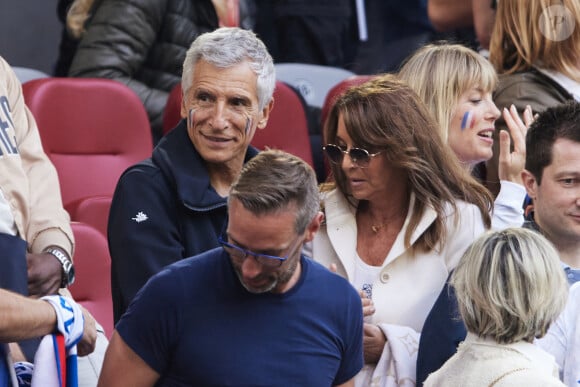 Nagui et sa femme Mélanie Page, Claude Deschamps - Célébrités dans les tribunes du match du groupe D de l'Euro 2024 entre l'équipe de France face à l'Autriche (1-0) à Dusseldorf en Allemagne le 17 juin 2024. © Cyril Moreau/Bestimage