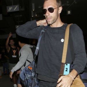 Chris Martin va prendre un avion à l'aéroport de Lax à Los Angeles, le 22 mai 2014.