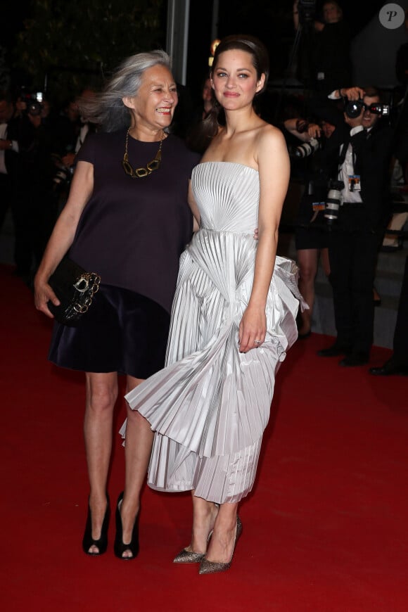 Niseema Theillaud, mère de Marion Cotillard, accompagne des artistes et créateurs dans leur développement personnel et professionnel
Marion Cotillard et sa mère Niseema Theillaud - Montée des marches du film "L'homme qu'on aimait trop" lors du 67 ème Festival du film de Cannes – Cannes le 21 mai 2014. 