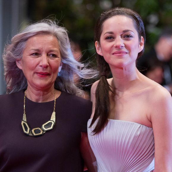 "Elle a eu milles vies" 
Marion Cotillard et sa mère Niseema Theillaud - Montée des marches du film "L'homme qu'on aimait trop" lors du 67 ème Festival du film de Cannes. 