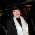 Régine et son chapeau claque à une soirée parisienne