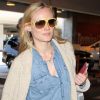 Même en ville, Diane Kruger soigne son look et opte pour du jean et des tons beiges. Los Angeles, 9 avril 2011