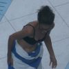 Suri Cruise et Katie Holmes se sèchent en sortant de la piscine de leur hôtel de Miami, en Floride. 16 juillet 2011