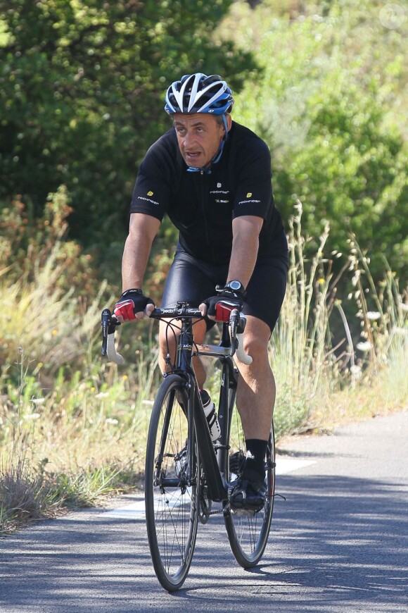 Nicolas Sarkozy en excursion à vélo, le 18 juillet 2011.