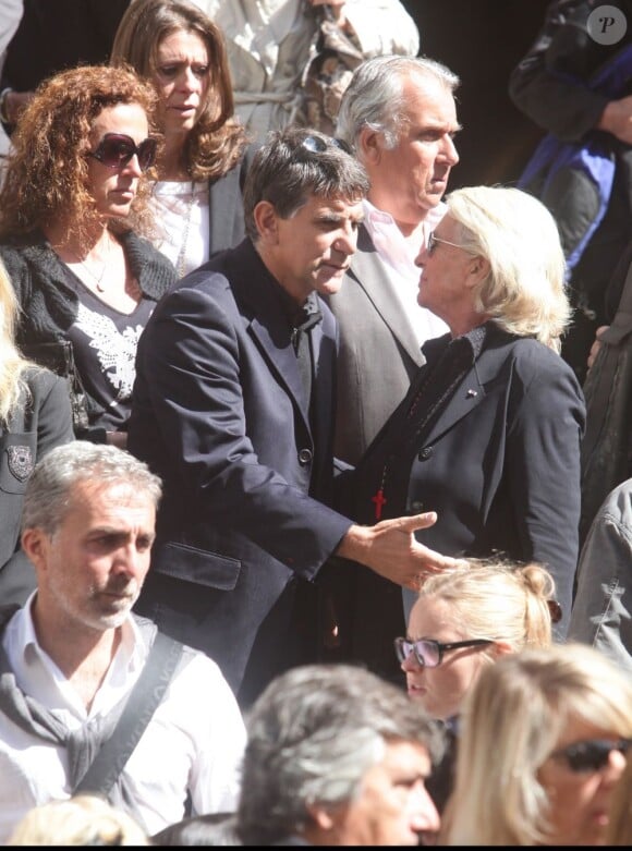 Tex et Véronique de Villèle lors des obsèques de Patrick Guillemin, en l'église Saint-Roch, à Paris, le 30 août 2011.