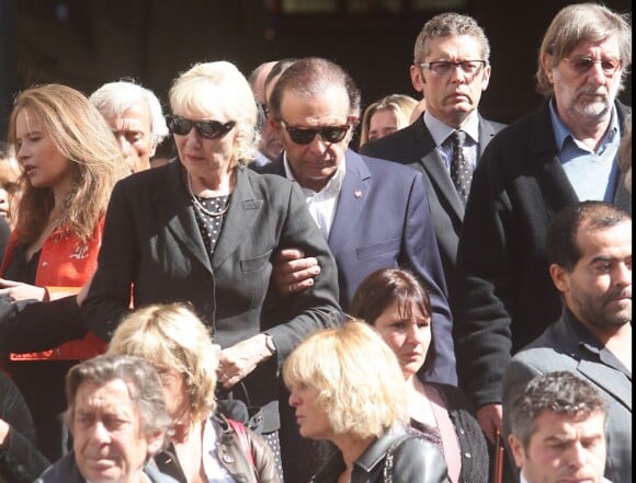 Roland Giraud et Maaike Jansen lors des obsèques de Patrick Guillemin, en l'église Saint-Roch, à Paris, le 30 août 2011.