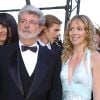 George Lucas et la fille de Dick Rivers lors de la montée des marches de La Revanche des Sith à Cannes le 14 mai 2005