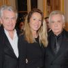 Michel Sardou, accompagné de son producteur Gilbert Coullier et son épouse Nicole, reçoit les clés du Connemara à l'ambassade d'Irlande à Paris, le 15 novembre 2011.