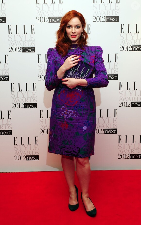Meilleure Actrice Télé, la star de la série Mad Men Christina Hendricks était radieuse dans une robe vintage Carolina Herrera. Londres, le 13 février 2012.