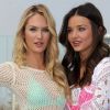Candice Swanepoel et Miranda Kerr, sexy pour lancer la collection Swim 2012 de Victoria's Secret à Beverly Hills. Le 29 mars 2012.