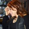 Alyson Hannigan, stylée et de bonne humeur, retourne à son hôtel new-yorkais. Le 4 avril 2012.