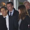 Nicolas Sarkozy et Carla Bruni repartent avec le sourire d'un débat de l'entre-deux tours musclé, à La Plaine Saint-Denis, le 2 mai 2012.