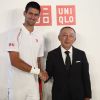 Novak Djokovic et le président d'Uniqlo, Tadashi Yanai, son nouvel équipementier, le 23 mai 2012 à Paris
