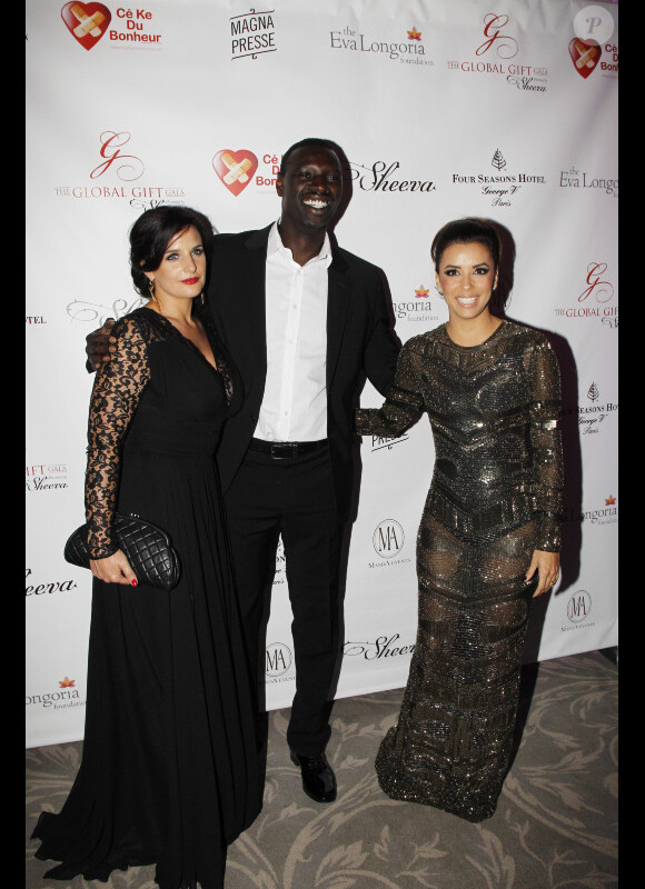 Omar Sy, sa femme Hélène et Eva Longoria au Global Gift Gala à l'hôtel George V à Paris, le 28 mai 2012