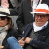 Michel Leeb et sa femme Béatrice lors du match entre Jo-Wilfried Tsonga et Novak Djokovic le 5 juin 2012 à Roland-Garros