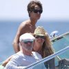 Elle Macpherson et son compagnon Roger Jenkins se font conduire par le fils de l'ancien top, Arpad Flynn le 16 juillet 2012 à Ibiza