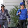 Johnny Hallyday et son épouse Laeticia devant son domicile de Pacific Palisades, Los Angeles, le 7 septembre 2012.