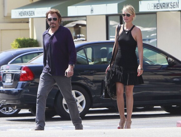 Johnny Hallyday et Laeticia Hallyday dans le quartier de Beverly Hills où ils se rendent chez leur coiffeur, le 10 septembre 2012.