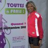 Sylvie Tellier pose à l'occasion de la randonnée cycliste organisée dans le cadre de l'opération Toutes à Paris, le dimanche 16 septembre 2012.
