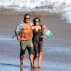 Christian Audigier et Nathalie Sorensen se promènent sur la plage, à Los Angeles, le mercredi 19 septembre 2012.