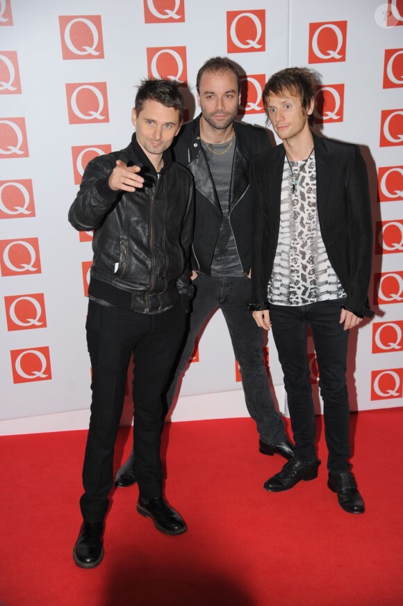 Matthew Bellamy, Chris Wolstenholme et Dominic Howard du groupe Muse à la soirée 2012 Q Awards à Londres, le 22 octobre 2012.