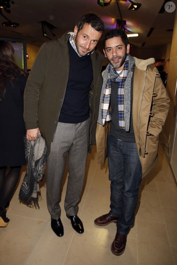 Julien Boisselier et Manu Payet assistent à la soirée de lancement de la collection Maison Martin Margiela pour H&M dans la boutique H&M des Champs-Élysées. Paris, le 14 novembre 2012.