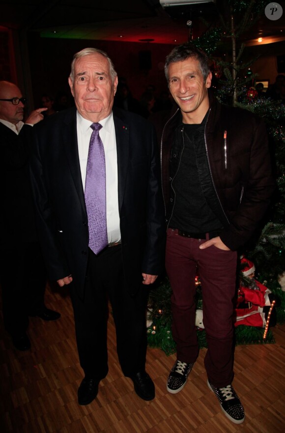Julien Lauprêtre assiste avec Nagui à la soirée de lancement de l'opération les Pères Noel Verts à Paris le 3 décembre 2012.