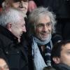 Luis Fernandez et Louis Bertignac au Parc des Princes pour le match PSG - Ajaccio, vendredi 11 janvier à Paris.