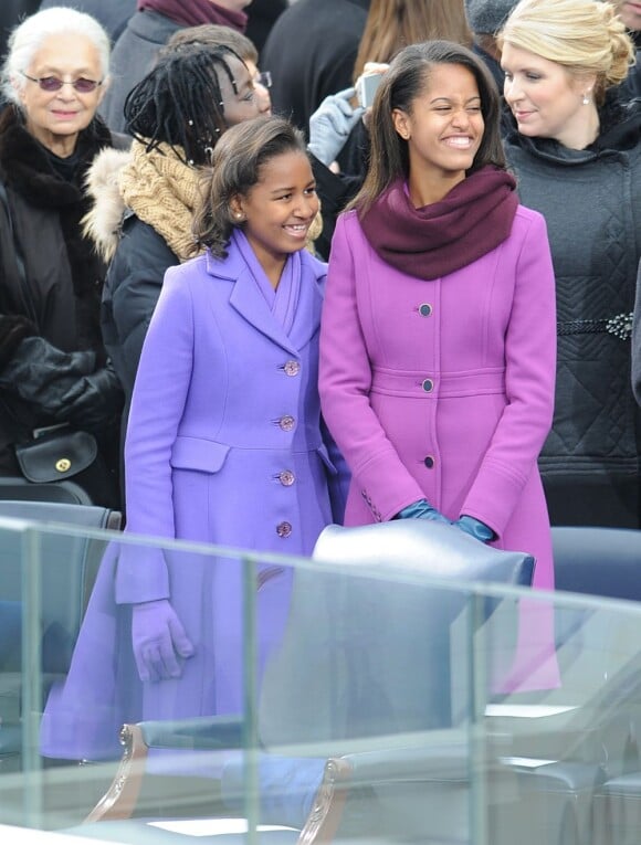 Sasha et Malia Obama portent des marques mainstream mais pointues à la cérémonie d'investiture de leur papa Barack Obama à Washington le 21 janvier 2013. Les soeurs ont choisi Kate Spade et J. Crew
