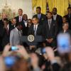 Barack Obama et toute l'équipe du Heat de Miami, champion NBA 2011-2012, lors d'une cérémonie organisée en son honneur à la Maison Blanche à Washington le 28 janvier 2013