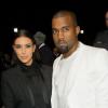 Kim Kardashian et Kanye West assistent au défilé Givenchy prêt-à-porter automne-hiver 2013-2014 à la Halle Freyssinet. Paris, le 3 mars 2013.