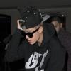 Justin Bieber sort d'un restaurant et va au cinéma à Londres, le 3 mars 2013.