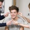 Louis Tomlinson des One Direction se fait mesurer pour entrer chez Madame Tussauds, le 11 mars 2013.