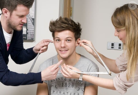 Louis Tomlinson des One Direction se fait mesurer pour entrer chez Madame Tussauds, le 11 mars 2013.