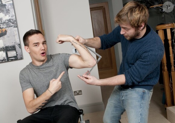 Liam Payne des One Direction se fait mesurer pour entrer chez Madame Tussauds, le 11 mars 2013.