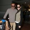 Christian Audigier et sa sublime fiancée Nathalie Sorensen arrivent à l'aéroport de Roissy CDG le 5 mars 2013.