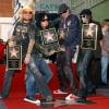 Les membres du groupe de metal Mötley Crüe reçoivent leur étoile sur le Hollywood Walk of Fame, à Los Angeles, le 25 janvier 2006.