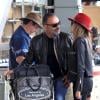 Christian Audigier avec sa fiancée Nathalie Sorensen à l'aéroport de Los Angeles pour prendre un vol en direction de Paris, le 5 mai 2013