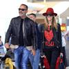 Christian Audigier et sa fiancée Nathalie Sorensen à l'aéroport de Los Angeles pour prendre un vol en direction de Paris, le 5 mai 2013