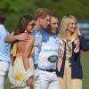 Le prince Harry bien entouré lors du Sentebale Royal Salute Polo Cup au polo club de Greenwich, dans le Connecticut, au dernier jour de sa visite officielle aux Etats-Unis, le 15 mai 2013. Une de ses harceleuses notoires rôdait.