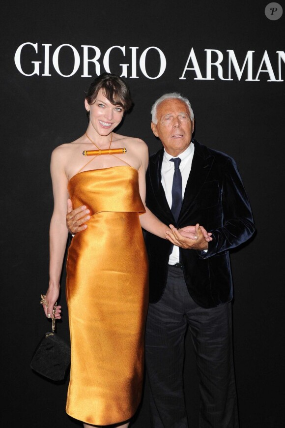 Giorgio Armani et Milla Jovovich à l'exposition Eccentrico à Rome qui célèbre la maison Armani. Le 5 juin 2013