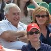 Dominique Strauss Kahn et sa compagne Myriam L'Aouffir pendant la finale dames à Roland-Garros le 8 juin 2013.