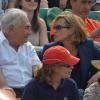 Dominique Strauss-Kahn et sa compagne Myriam L'Aouffir en complicité pendant la finale dames à Roland-Garros le 8 juin 2013.