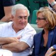 Dominique Strauss Kahn et sa compagne Myriam L'Aouffir à Roland Garros le 8 juin 2013.