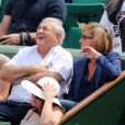 Dominique Strauss Kahn et sa compagne Myriam L'Aouffir à Roland Garros le 8 juin 2013.
