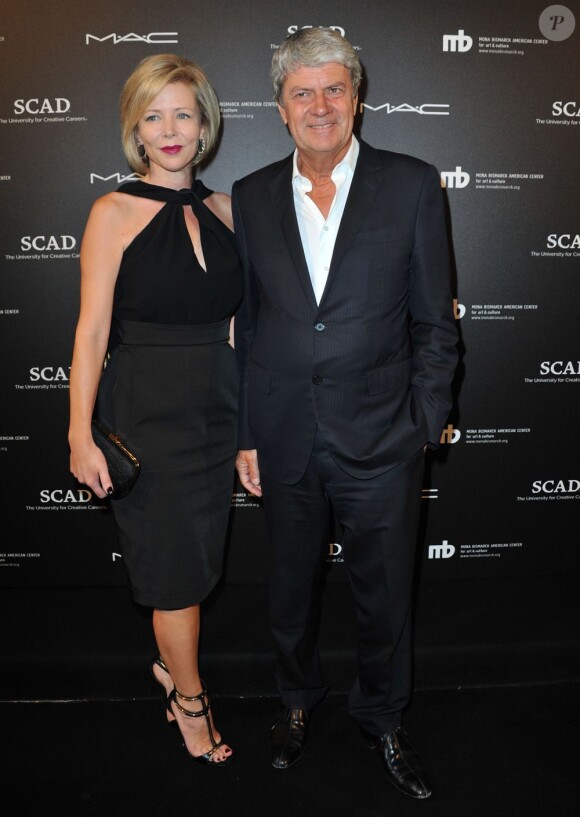 Yves Carcelle, ex-président de Louis Vuitton, et sa femme, assistent au vernissage de l'exposition Little Black Dress au Mona Bismarck American Center. Paris, le 1er juillet 2013.
